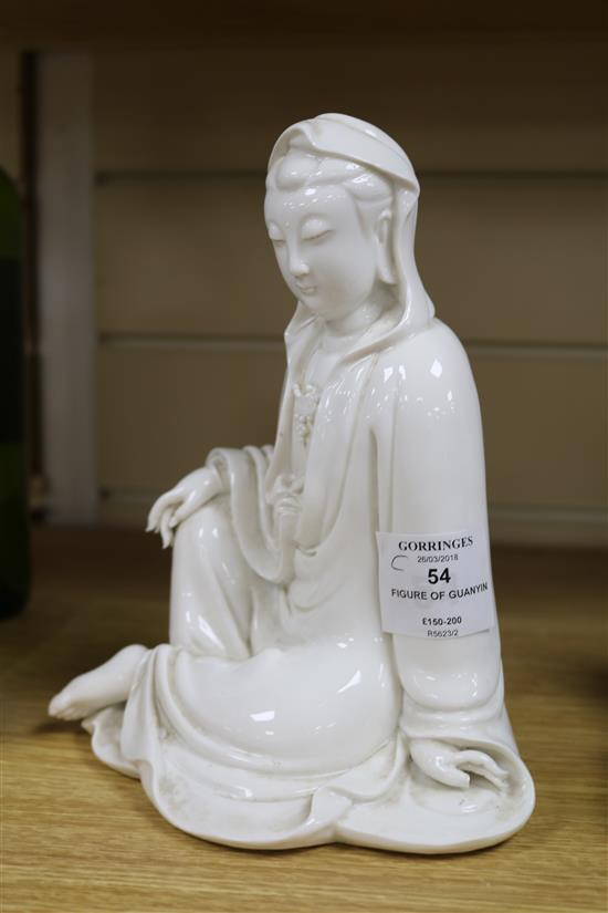 A Chinese blanc de chine seated figure of Guanyin H.21cm